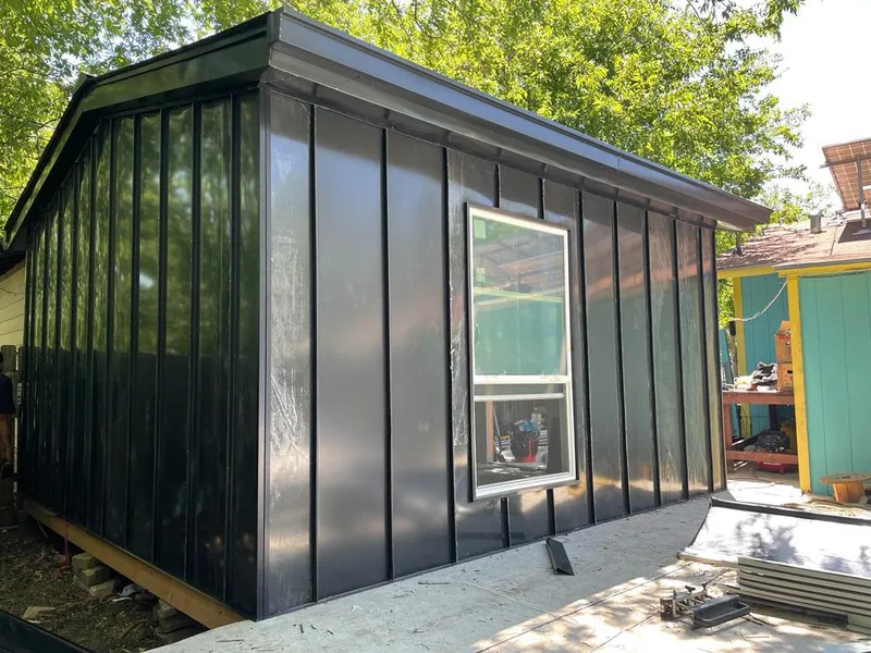 Black standing seam metal wall panels for Metal Roof Installation in Stillwater